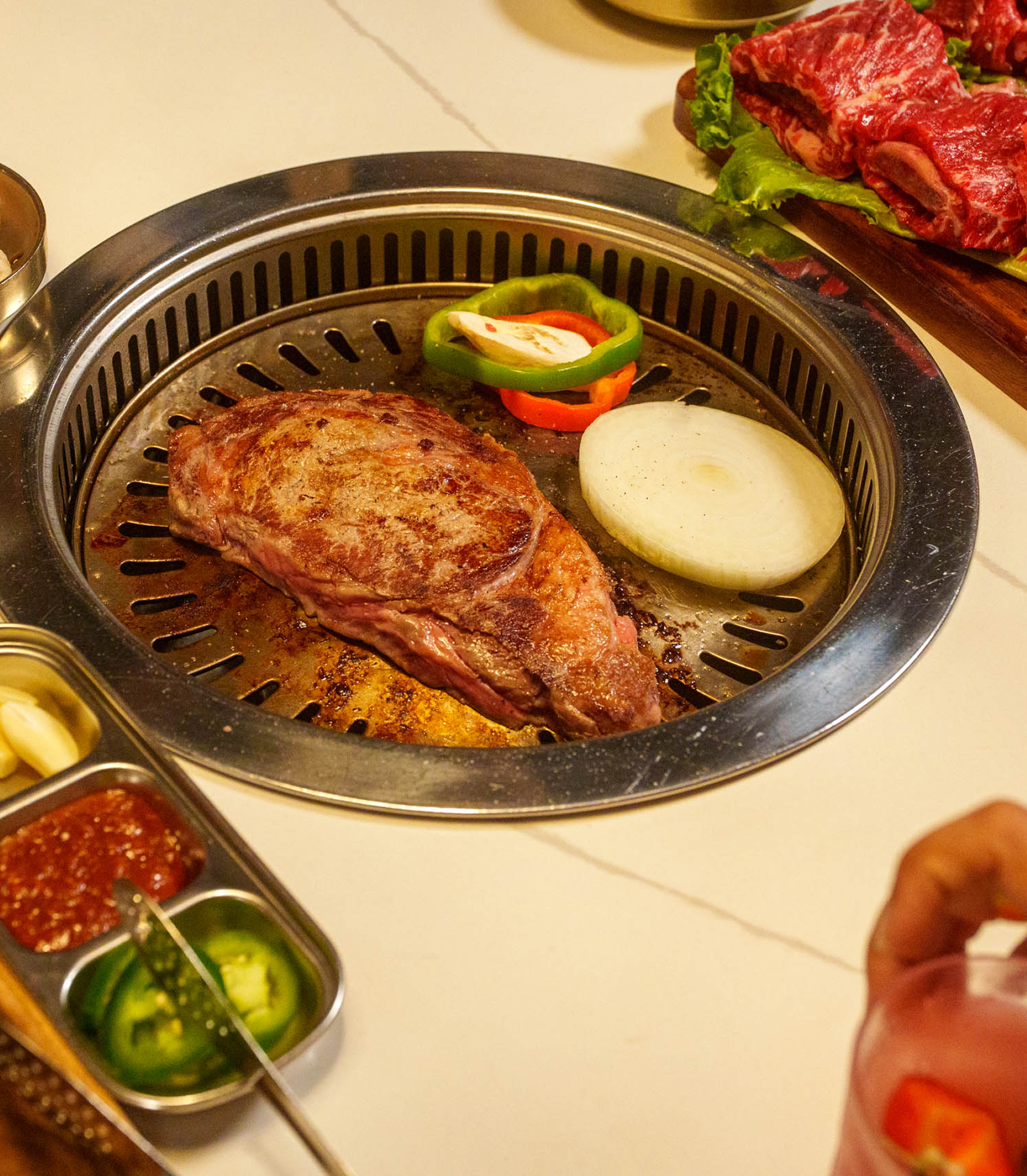 Steak and vegetables grilling at Koho