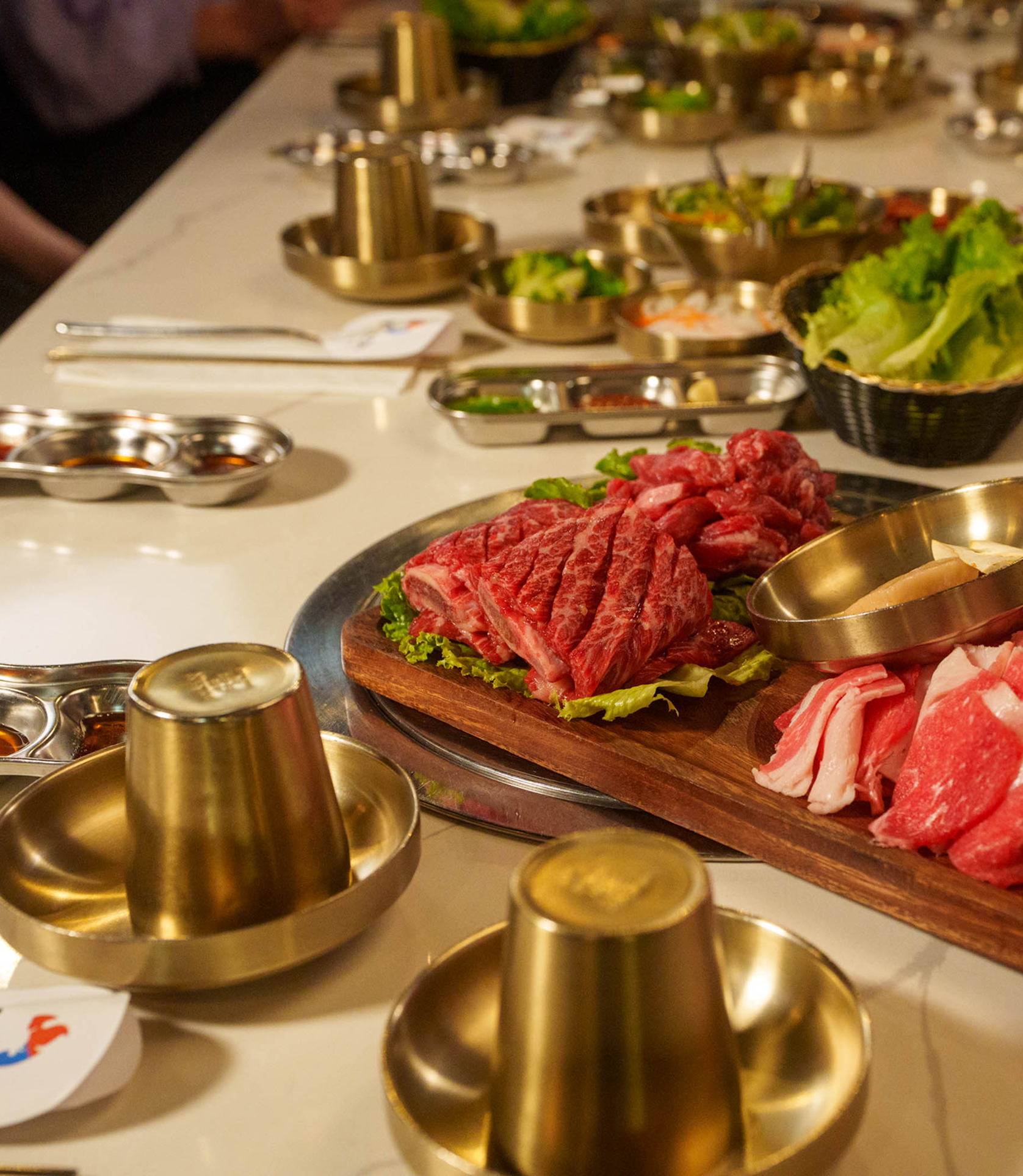 Premium Korean BBQ meats and side dishes at Koho